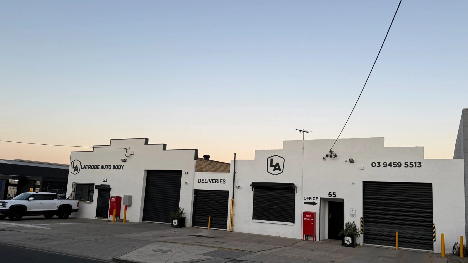Vehicles inside the Latrobe Auto Body repair workshop